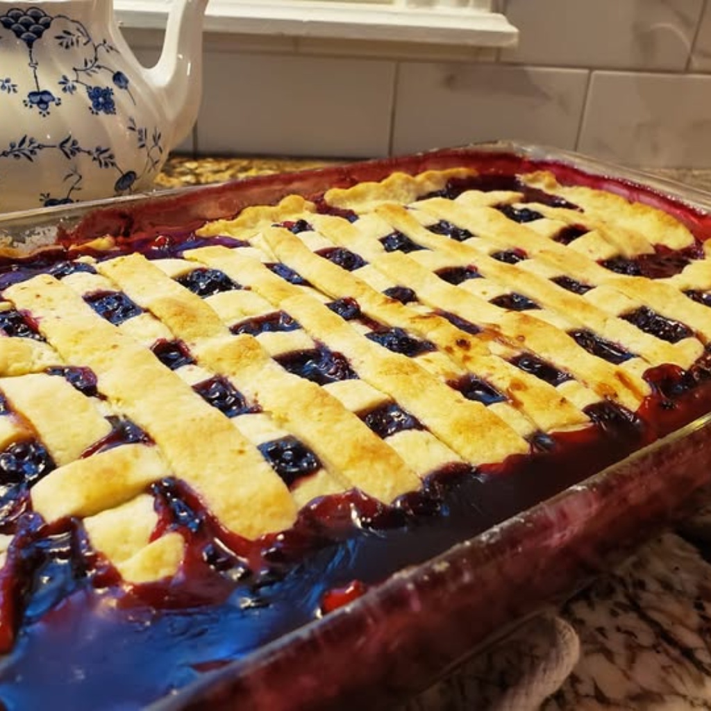 Blackberry Cobbler with a White Lily All Purpose Flour Crust.. From Bake with Love: Christmas Recipe Exchange - FB Includes: Blackberries, Granulated Sugar, Boiling Water, Cornstarch, Unsalted Butter, Table Salt, Ground Cinnamon, Lemon Juice, Pastry For Crust.